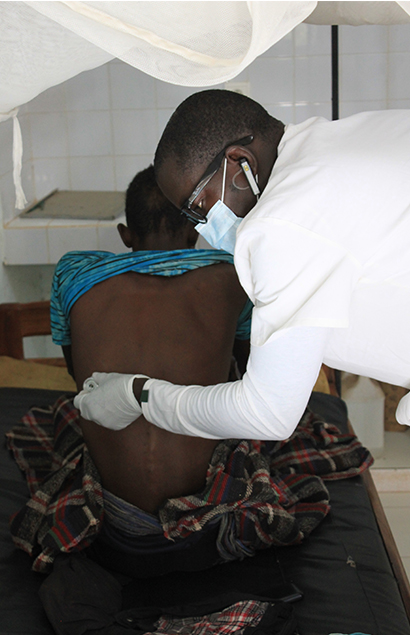 Doctor Mamadou Ndiaye during a consultation at the Wassadou Medical Center in Senegal